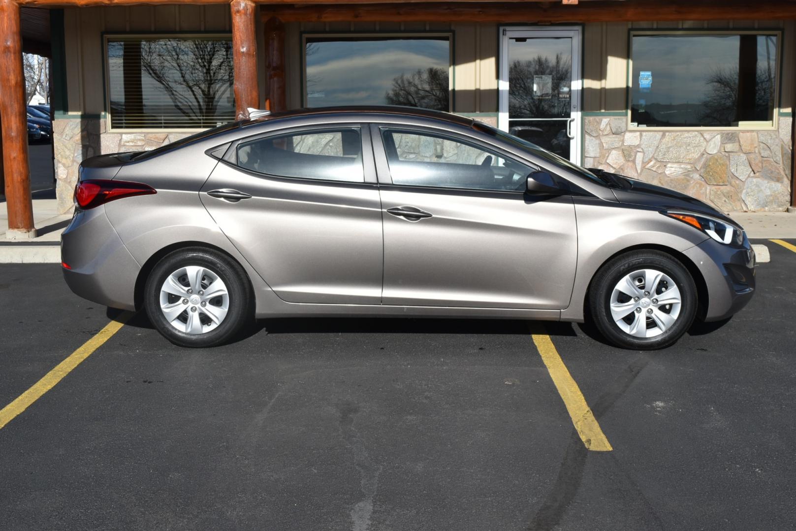 2016 Bronze Hyundai Elantra SE (5NPDH4AE3GH) with an 1.8L 4 Cyl engine, 6-Speed Automatic transmission, located at 1600 E Hwy 44, Rapid City, SD, 57703, (605) 716-7878, 44.070232, -103.171410 - Photo#4